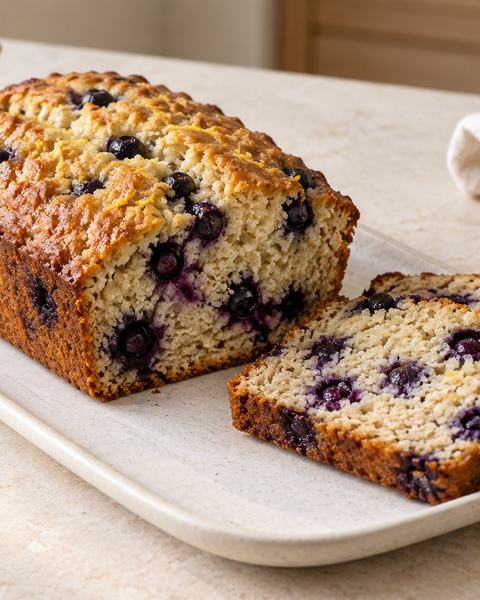 A sliced blueberry lemon loaf cake.